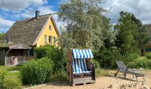 Ferienhaus Peeneblick- Wohnzimmer mit Kamin / Essbereich / Küche 2