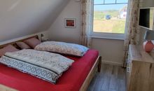 OG - Schlafzimmer 1 mit Blick auf die Üselitzer Wiek