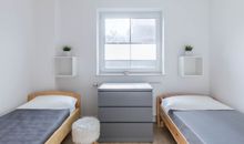 Schlafzimmer mit Einzelbetten im EG