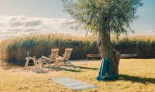 Ferienhaus Welle - Gartenanlage mit idyllischen Sitzplätzen